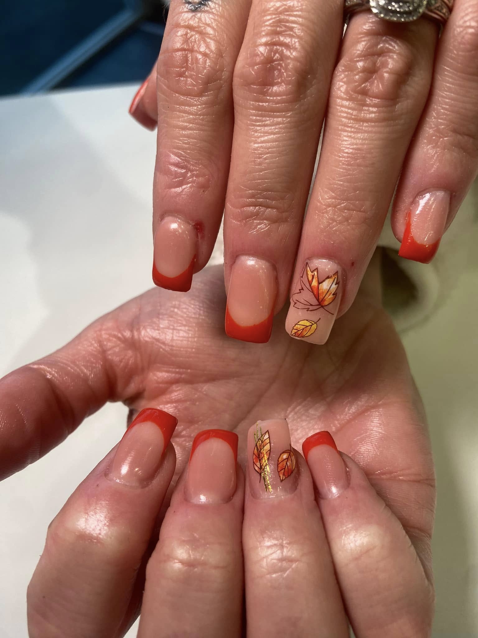 Gel manicure with autumn leaf design