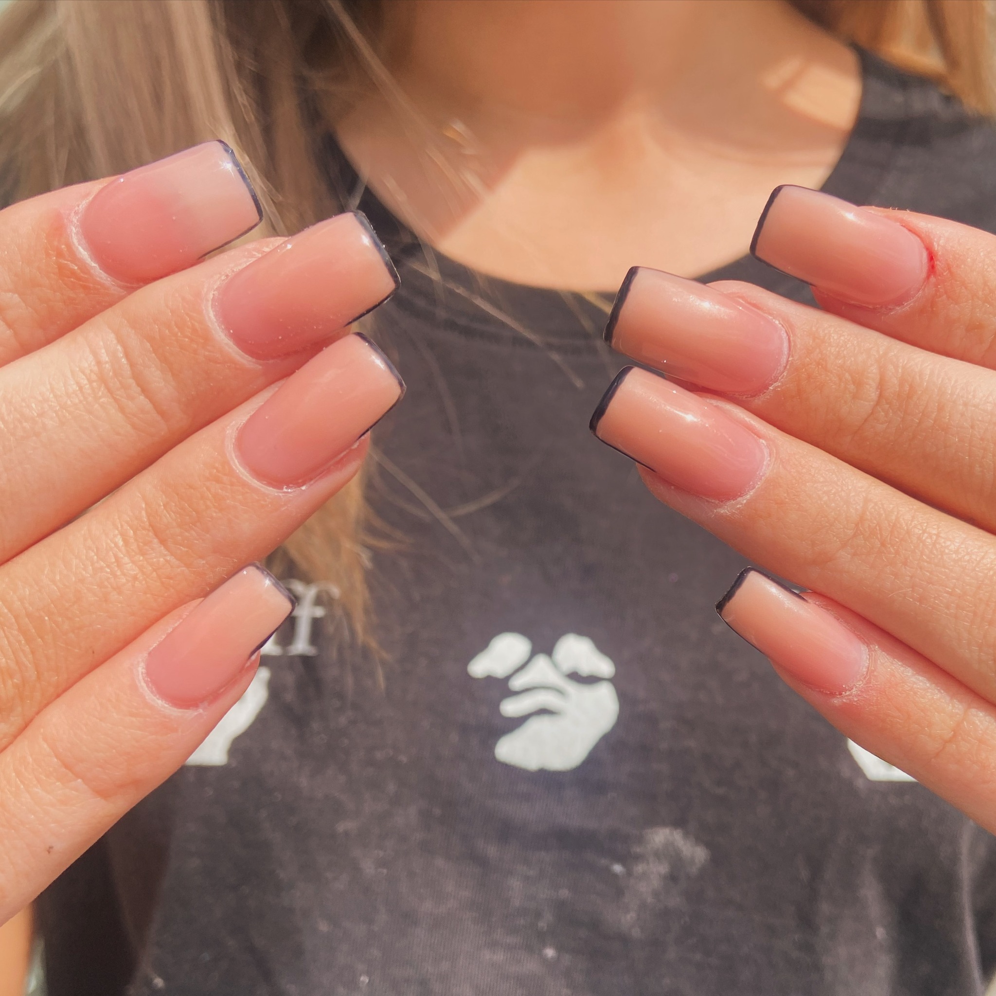 Gel manicure with black French tips